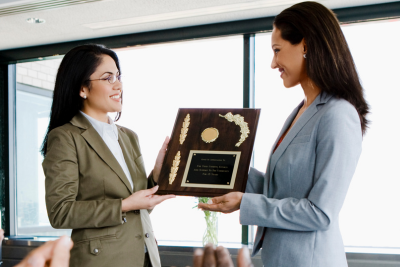 Image of an instructor receiving a teaching and learning award
