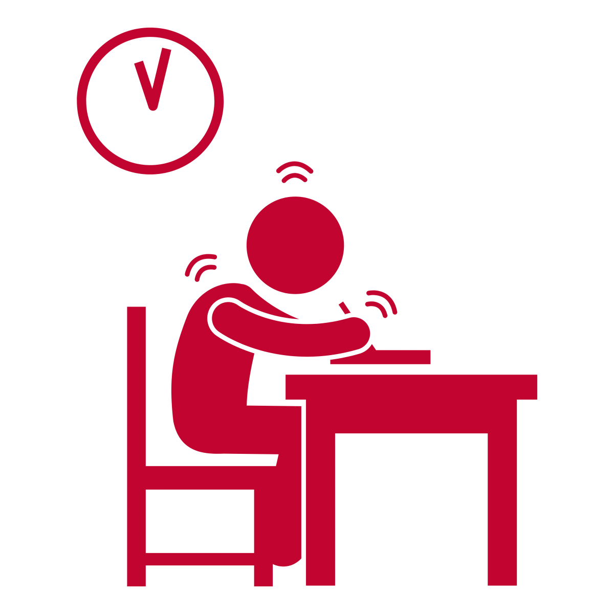 A student sitting at a desk writing an exam with a clock in the corner.